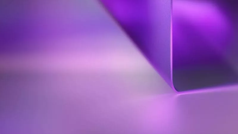 Abstract purple gradient background with a smooth curved shape.