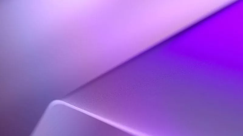 Abstract purple gradient background with a smooth curved shape.