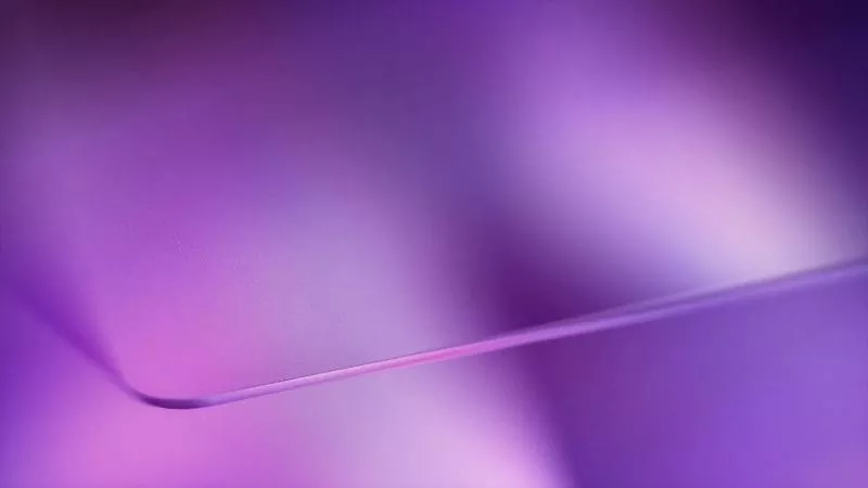 Abstract purple gradient background with a smooth curved shape.