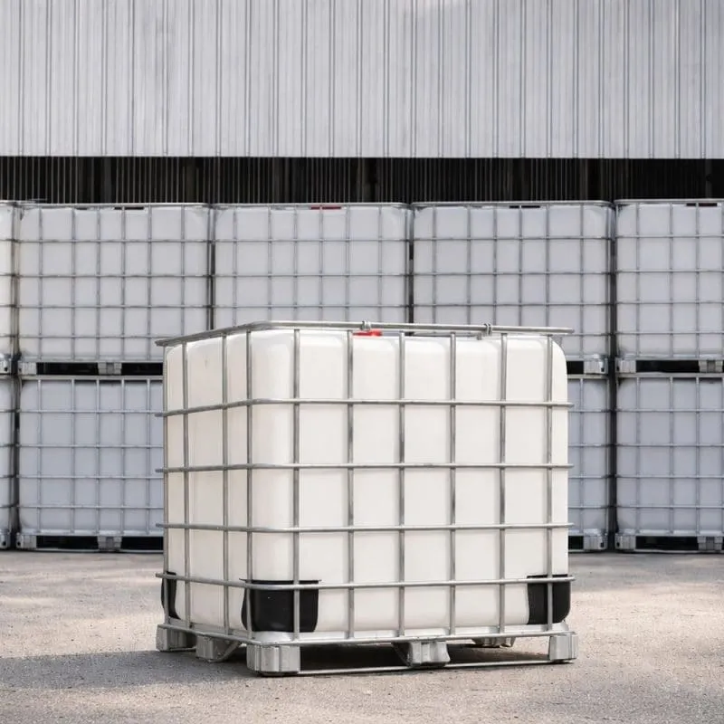 Large plastic storage containers stacked outside a warehouse.