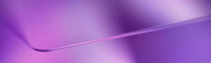 Abstract purple gradient background with a smooth curved shape.