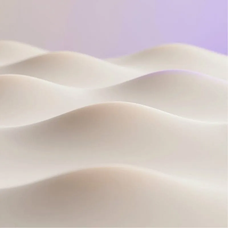 Soft, undulating wave-like forms in a smooth, matte surface with gentle lighting and a faint purple tint in the background.